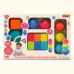 Playgo Busy Stack: set sensorial de 16 piezas en su caja original, vista frontal sobre fondo crema.