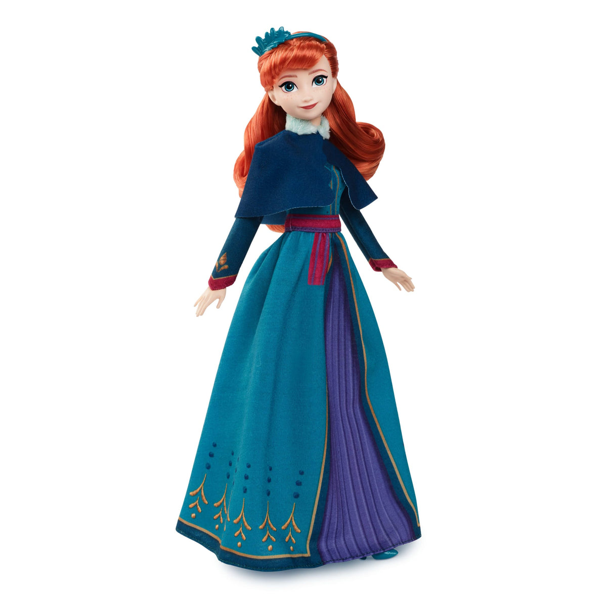 Muñeca Anna Frozen Celebration JDX42 con vestido turquesa y morado, capa azul y accesorio de cabello; fotografía oficial de Mattel.