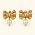 Aretes de moño y cuenta tipo perla