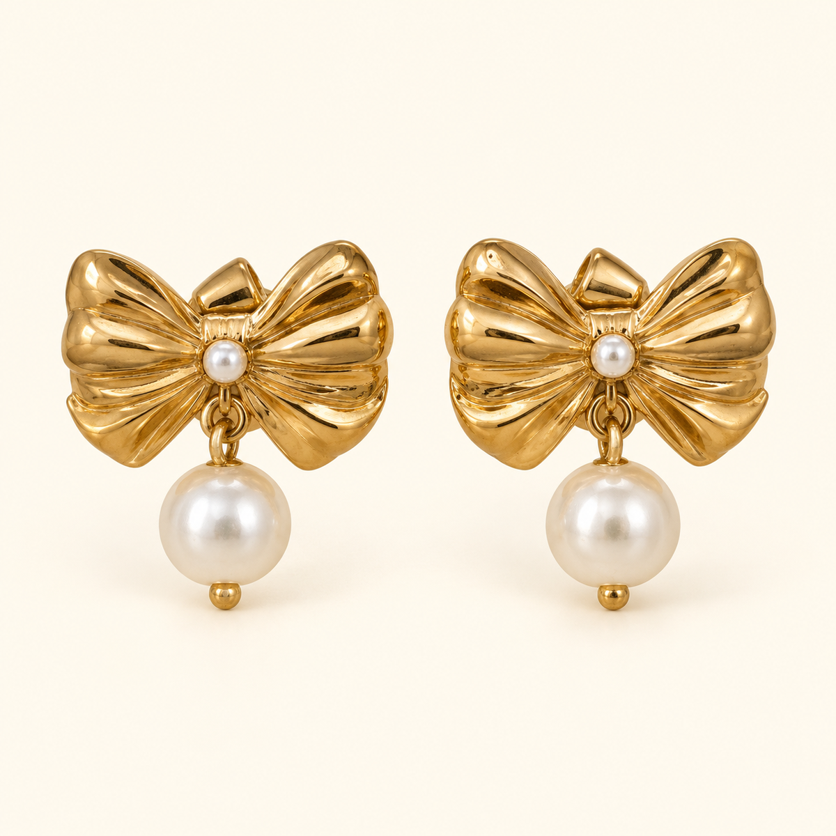 Aretes de moño y cuenta tipo perla