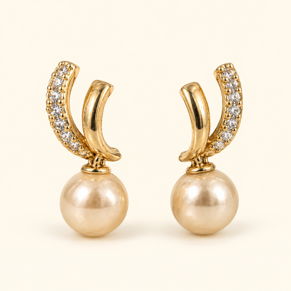 Aretes de doble curva y cuenta tipo perla